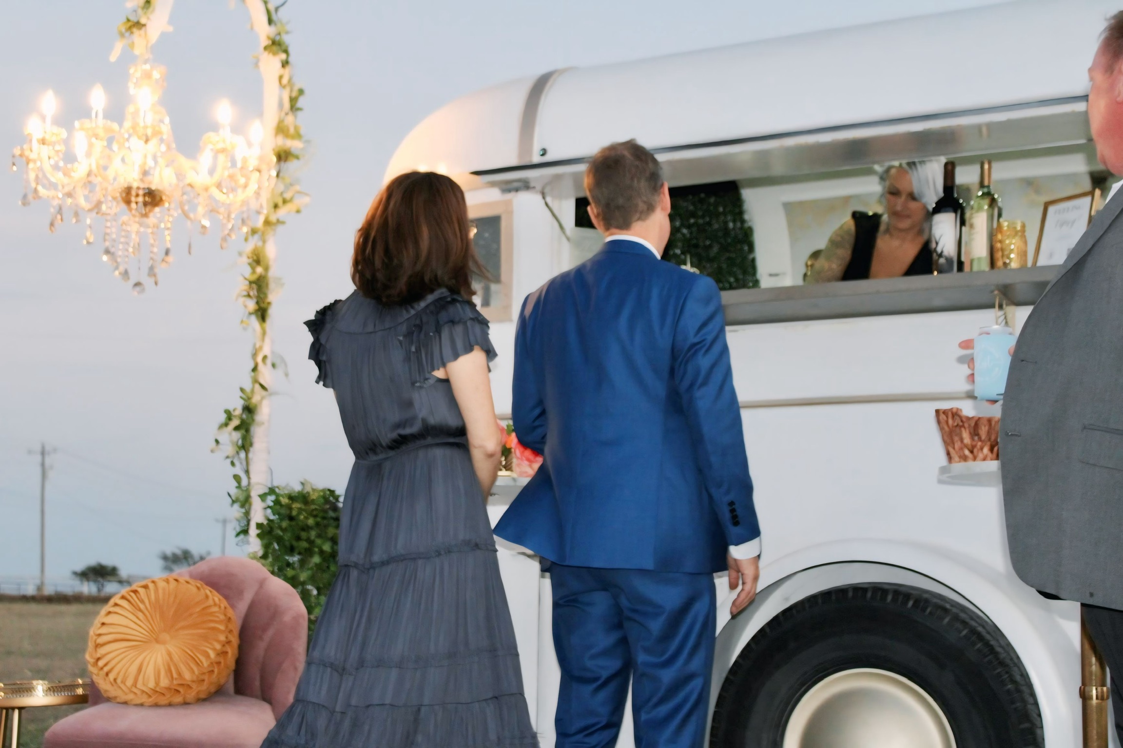 The Lucky Chandelier mobile bar trailer styled with florals